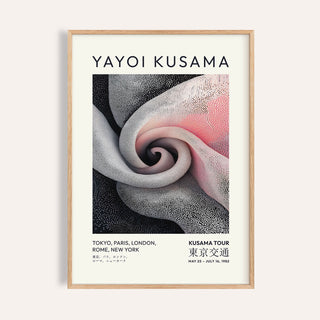 Framed print of a spiral dot pattern in black white and shades of pink with text above and below