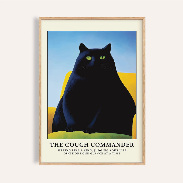 Cat Funny Poster framed print of a black cat with green eyes on a yellow couch