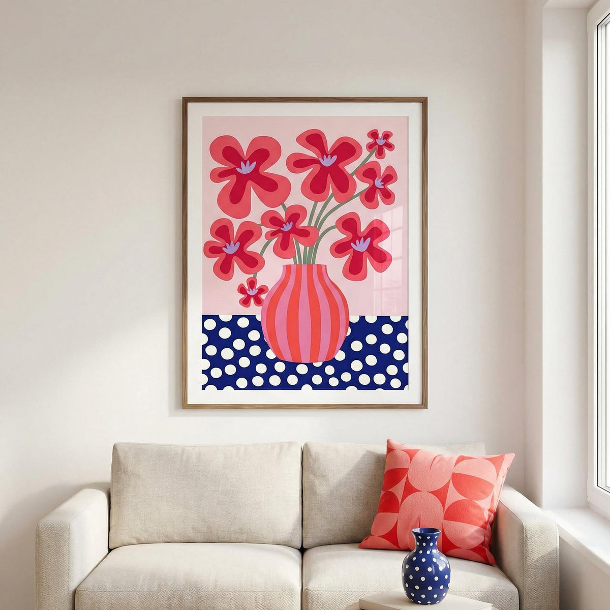 Colorful Flower Poster print of red stylized flowers with a striped vase above a sofa with a patterned cushion