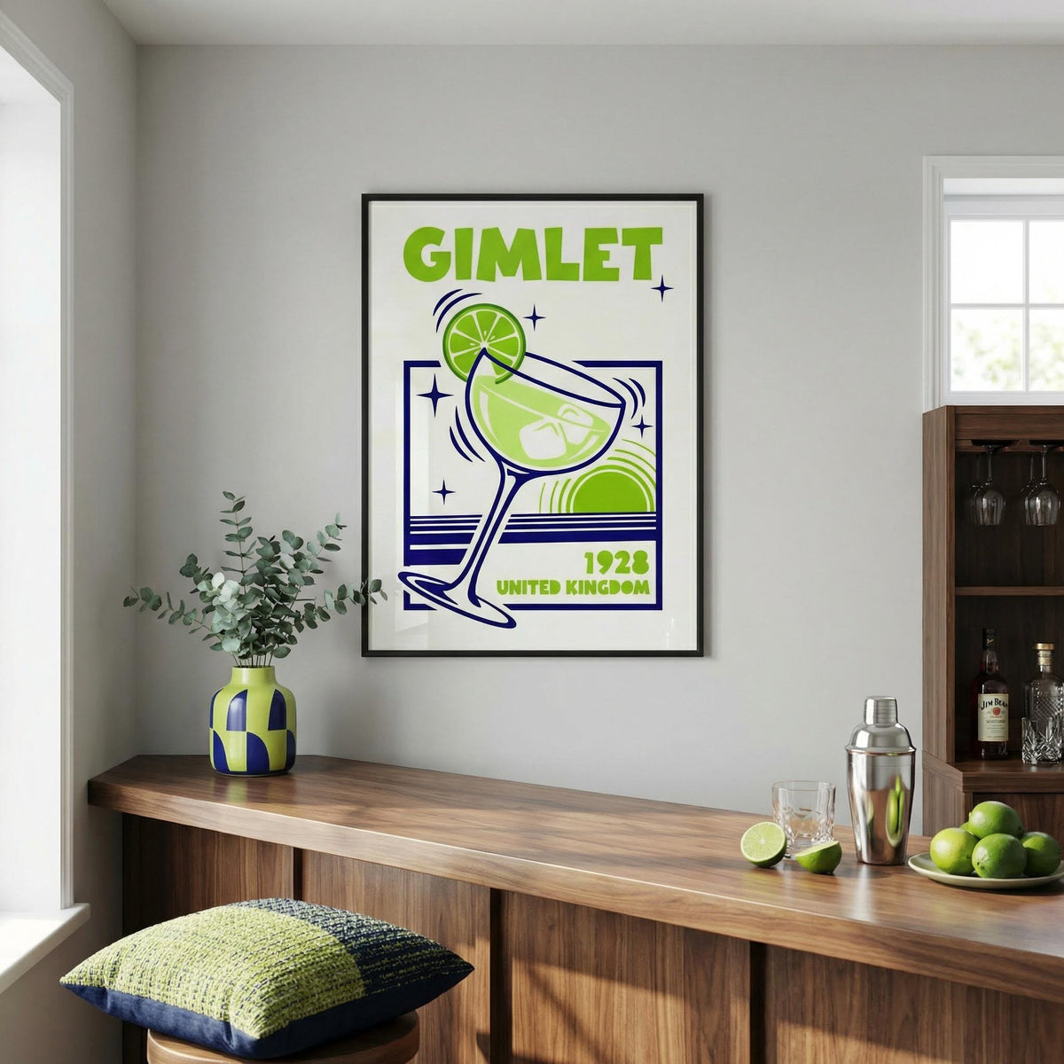 Gimlet Cocktail Poster print on a wall above a wooden counter with a green and blue vase and citrus accents in a kitchen