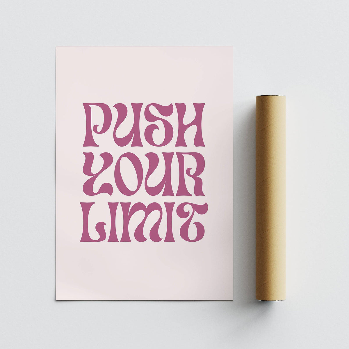Push Your Limit Poster with pink text on pale background shown rolled next to cardboard tube