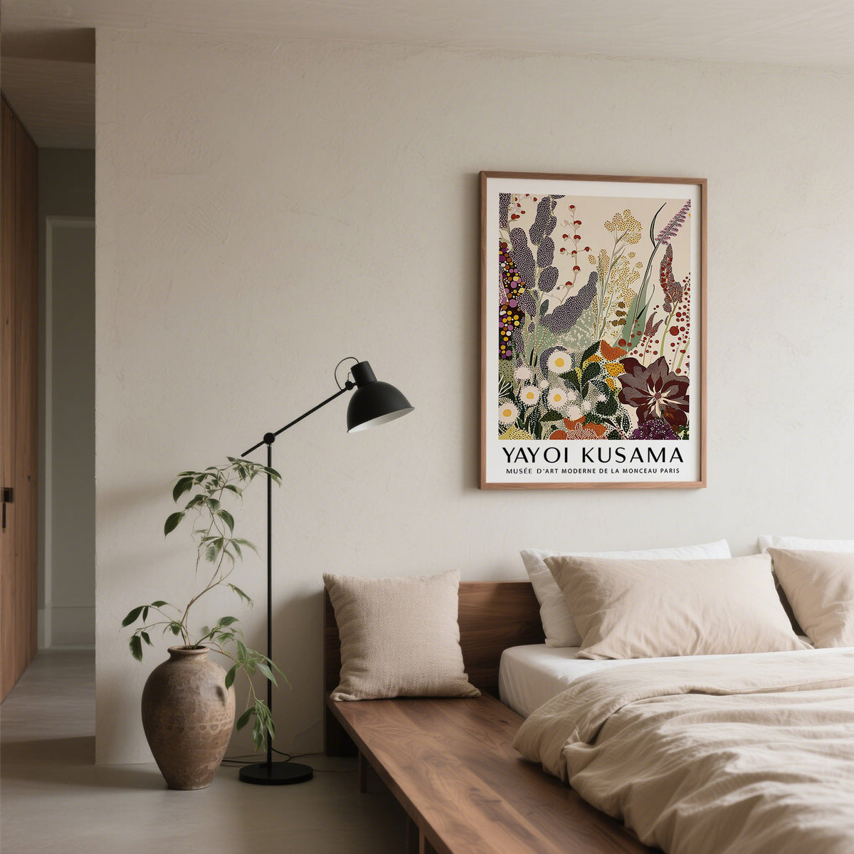 Abstract Floral Print on a bedroom wall with muted colours and a tall vase beside the bed