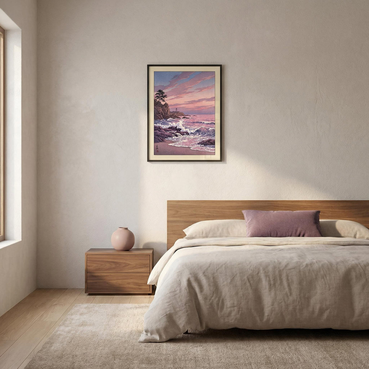 Lighthouse Sunset wall art of a rocky coastline at sunset in muted purples and pinks above a bed with a mauve cushion