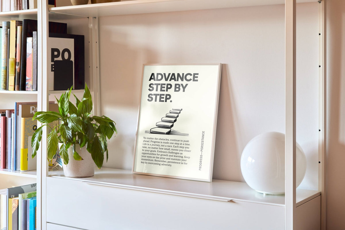 Print leaning on a shelf showing typographic motivational text with black stairs illustration and cream background