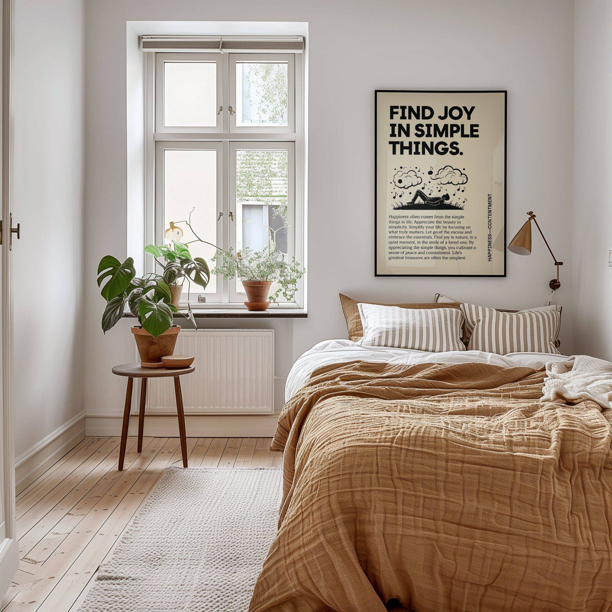 Inspirational art wall print with black text and silhouette above a bed with striped cushions