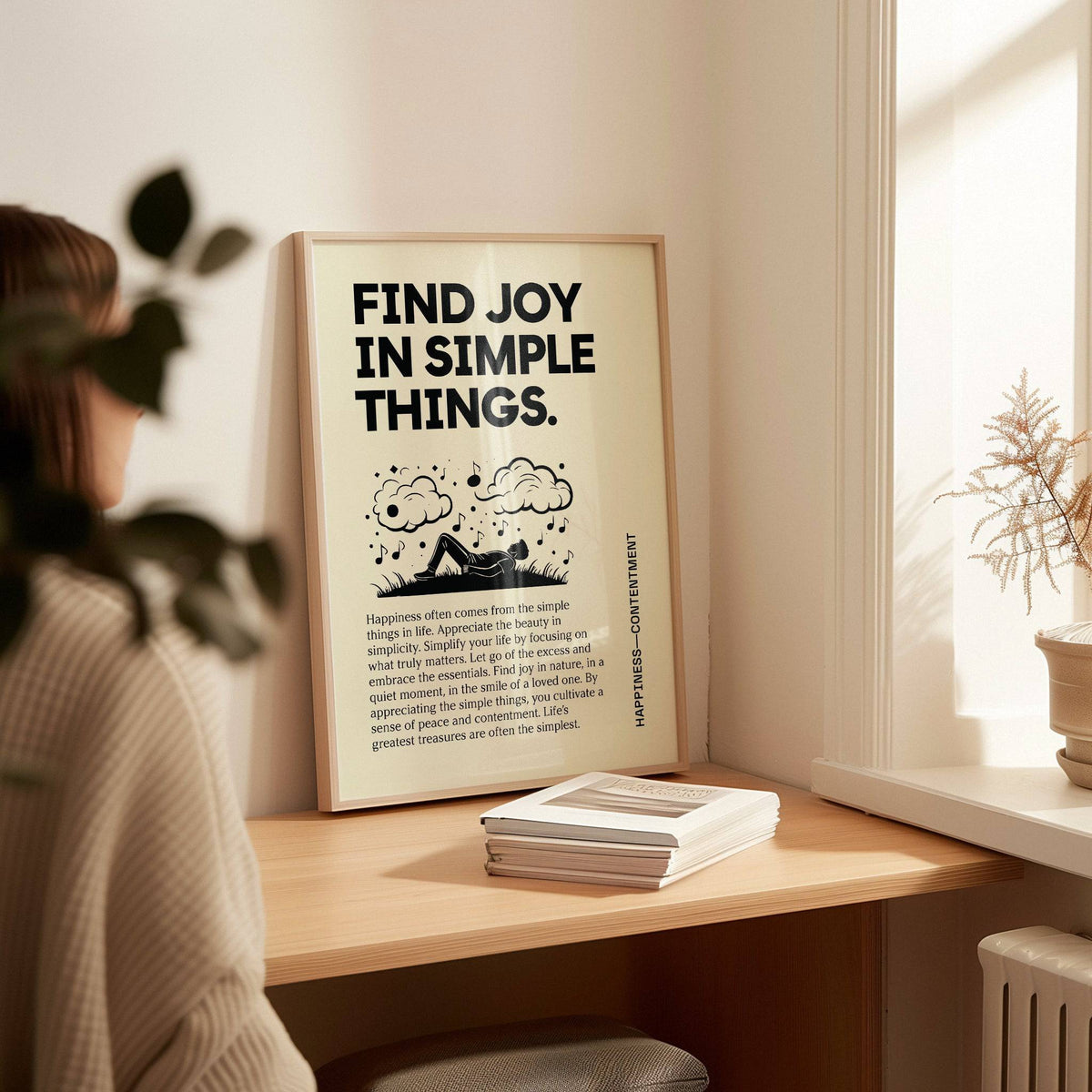 Print leaning on a desk inspirational art wall with black text and simple graphics in soft light