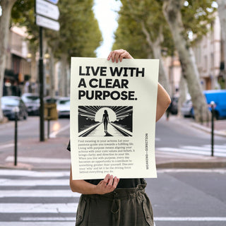 Motivational poster held by person outdoors showing typographic design with black silhouette on cream background
