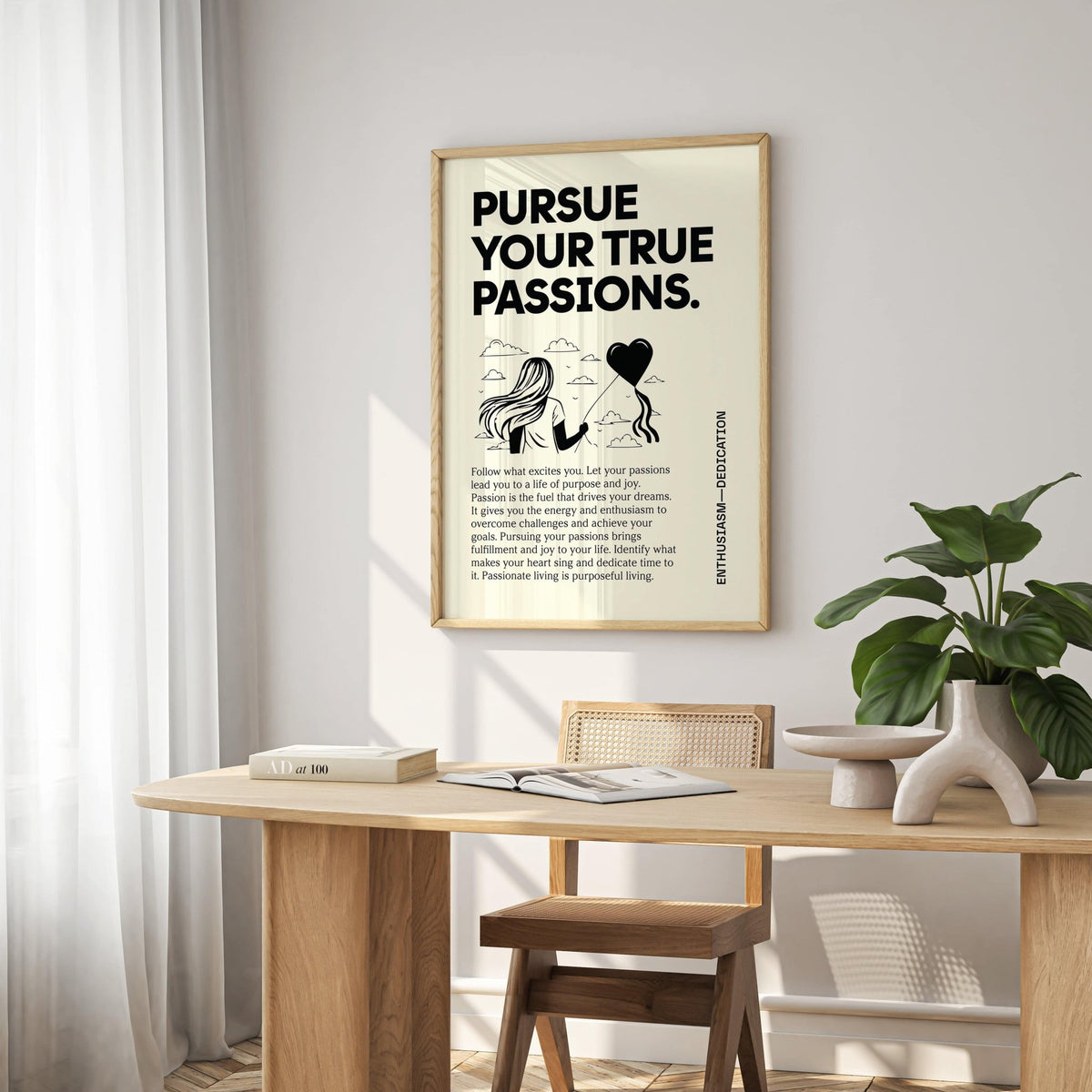 Inspirational wall art with a minimalist illustration of a woman holding a heart balloon above a wooden desk with a plant