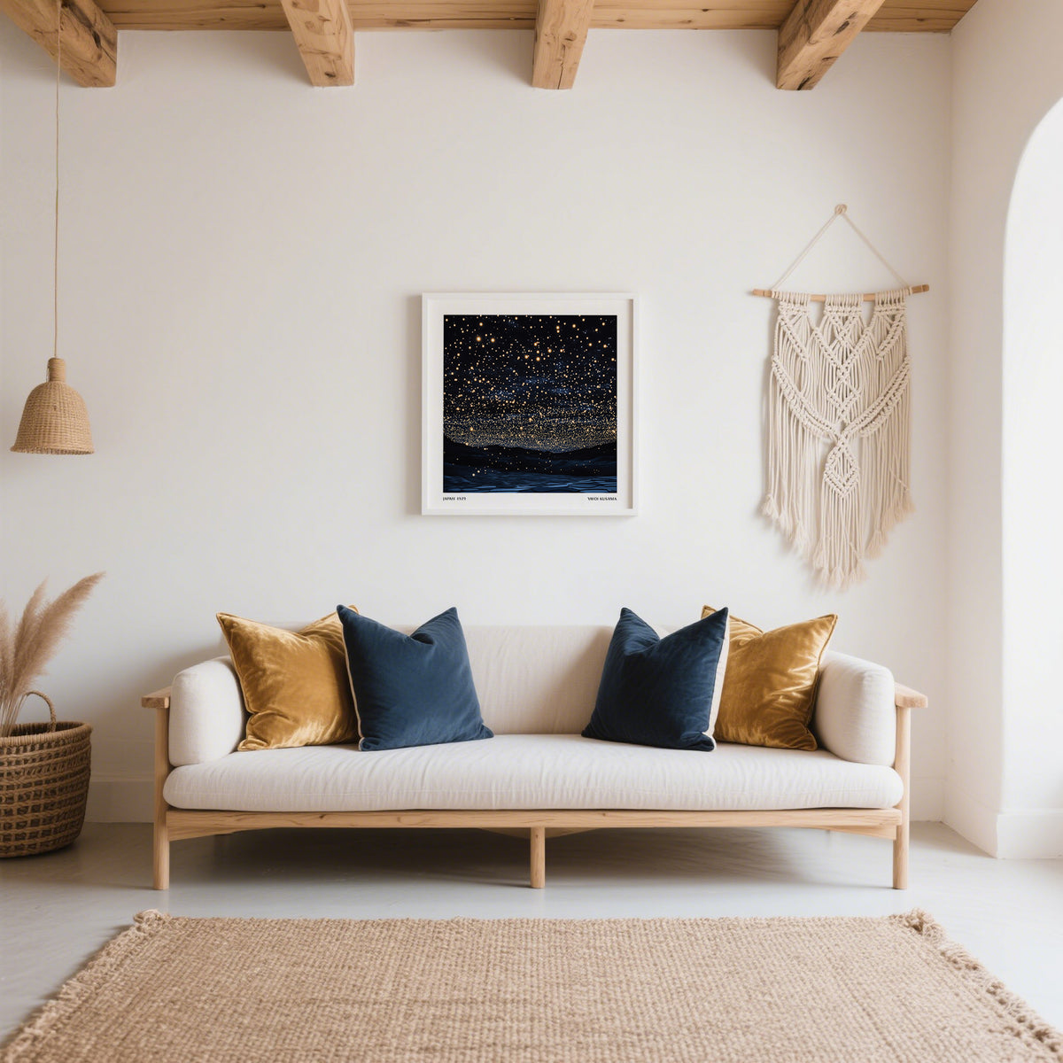 Starry Night Print of a dark sky with many glowing stars above a white sofa with cushions