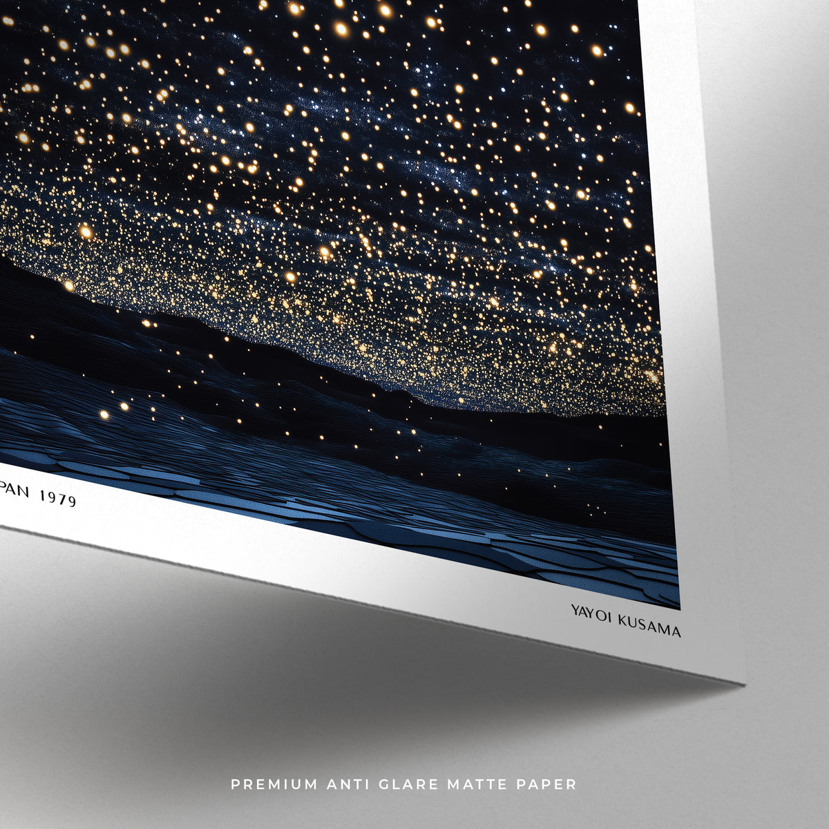 Detail close-up of starry night print showing bright stars over dark landscape