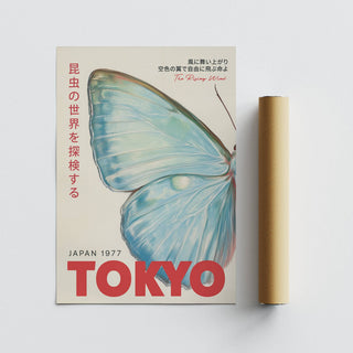 Japanese wall art showing a blue butterfly wing illustration with red text alongside a packaging tube