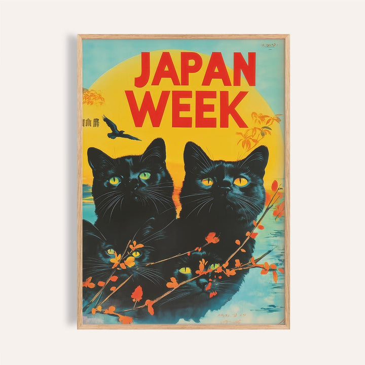 Close-up of retro wall prints with black cats and yellow eyes on a blue and yellow background