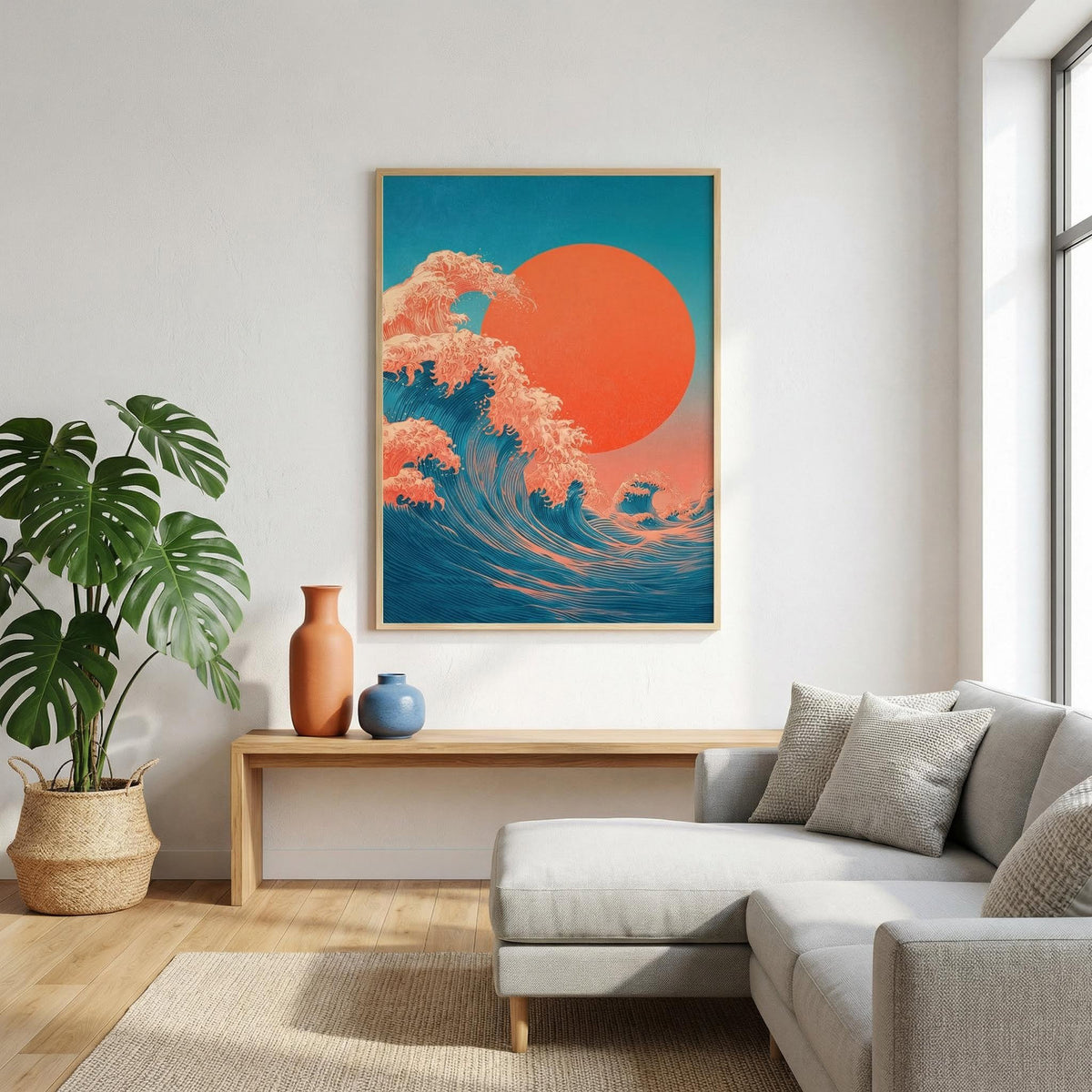 Japandi Waves Print on a living room wall with blue and orange waves and a large orange sun above a wooden console with vases