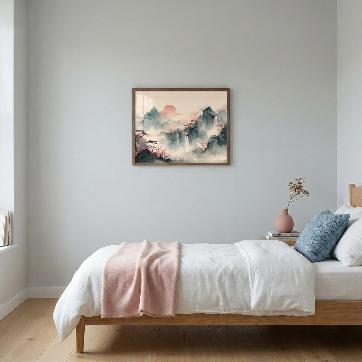 Tiger Mountain wall art of misty mountains with waterfalls in soft pink and grey above a bedside table with a pink vase