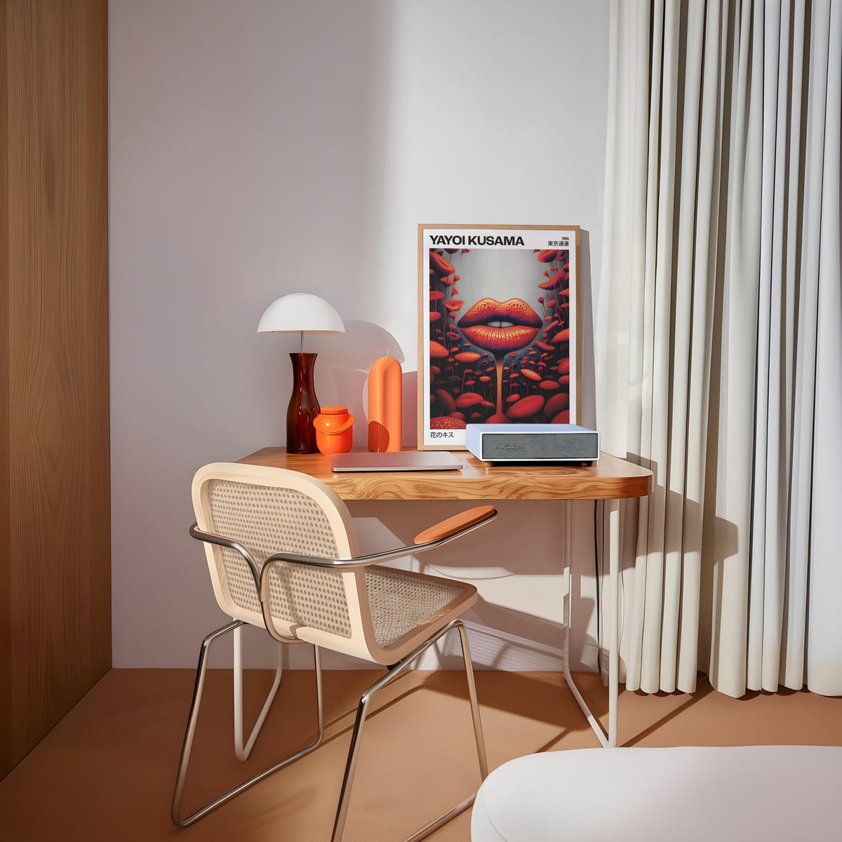 Print leaning on a desk of lips mushroom surreal illustration in red and black beside a white lamp