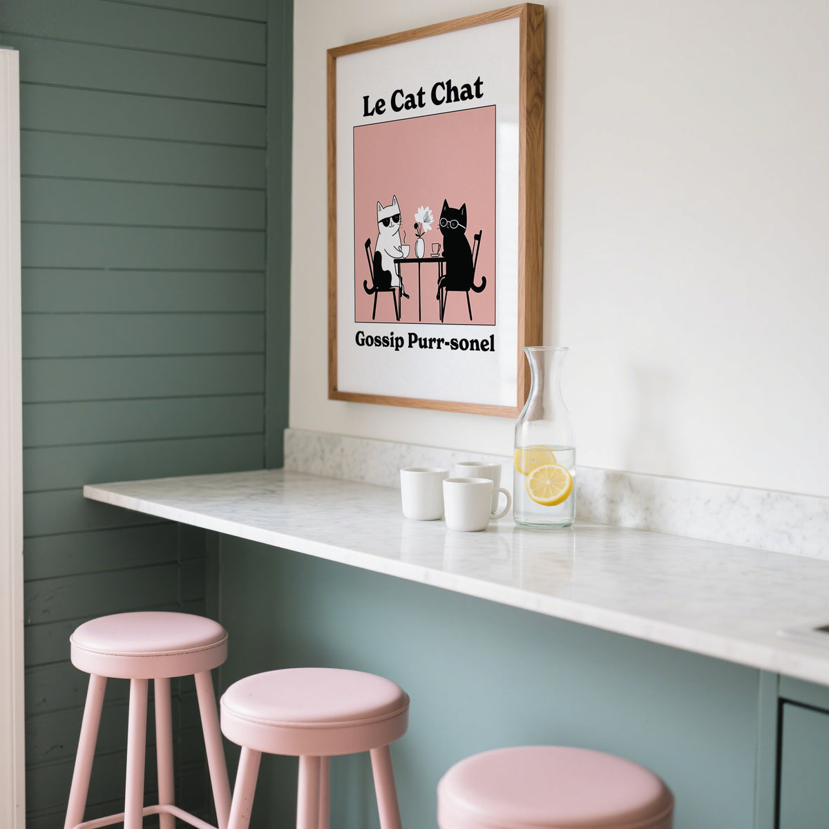 Funny Cat Artwork framed print of two cats at table with a pink background above kitchen counter with cups