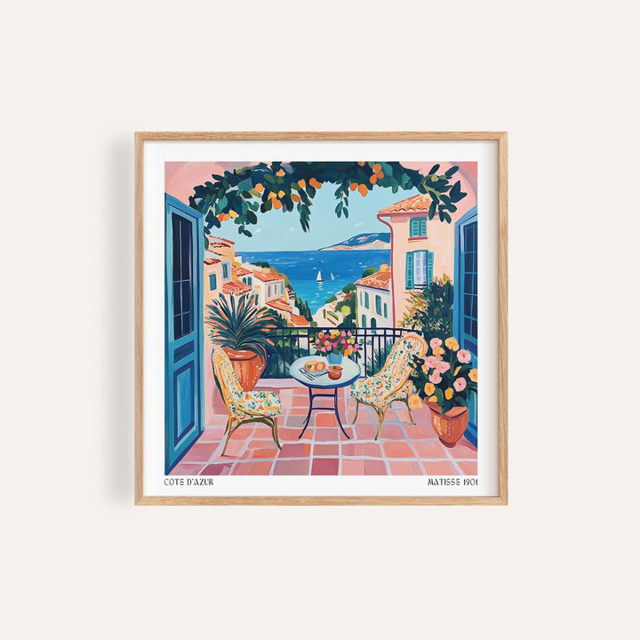 Framed French Coastal wall art of a seaside terrace with blue and terracotta colours