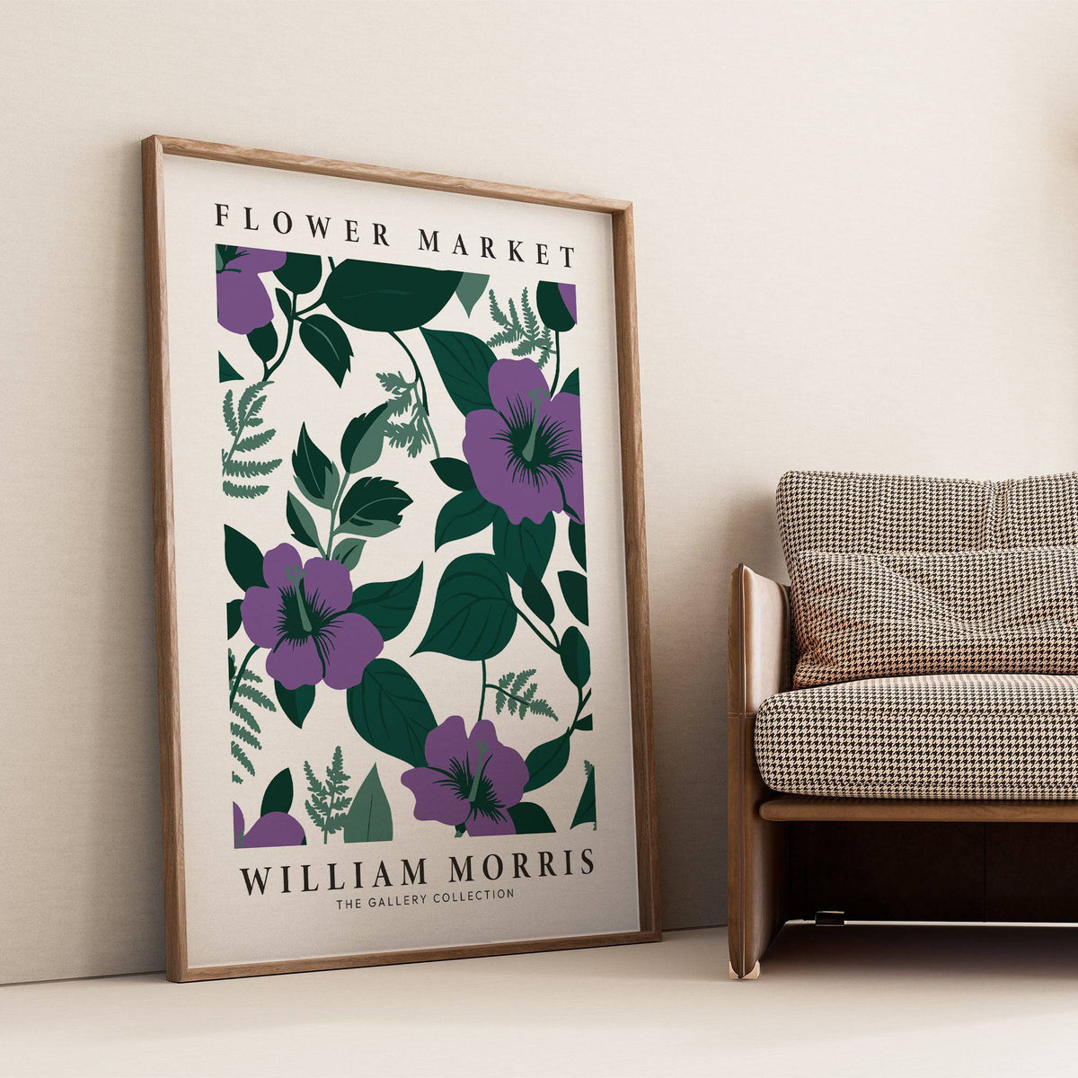 Purple Flower Artwork leaning against a wall with purple flowers and dark green leaves beside a patterned sofa