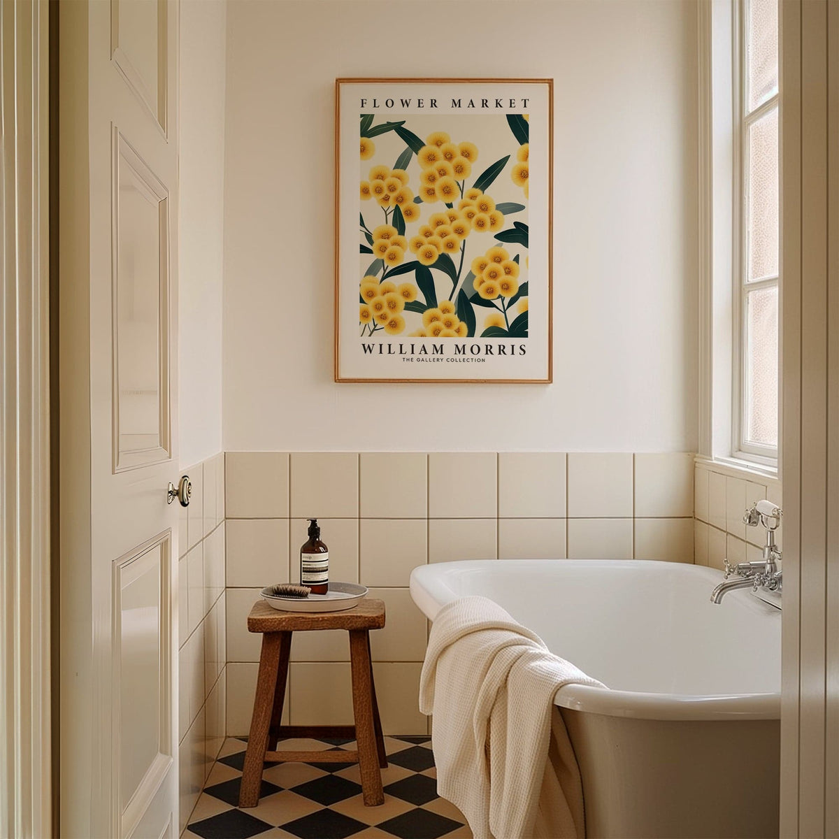 Yellow flower wall art of yellow pompom flowers in a bathroom above a wooden stool with toiletries