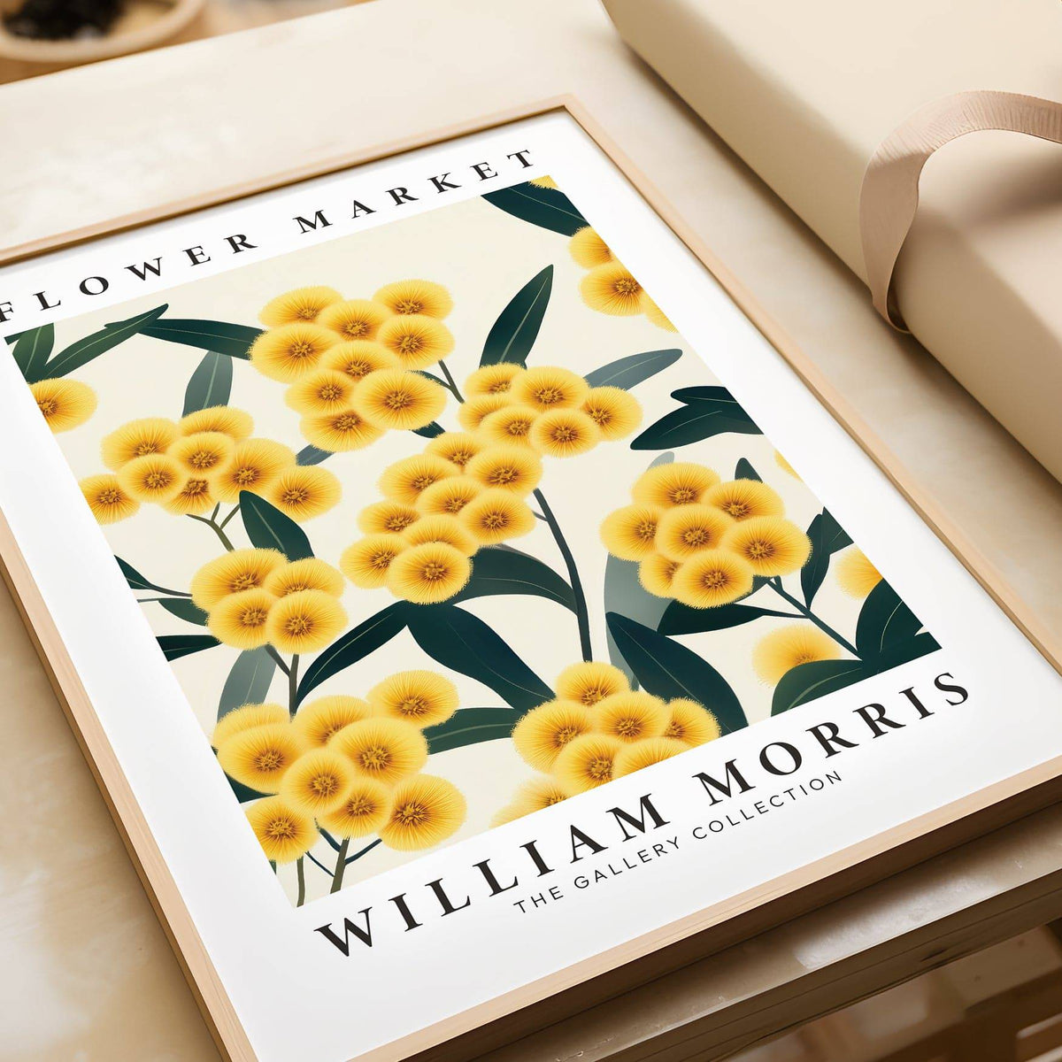 Close-up of yellow flower wall art with green leaves beside beige gift wrap