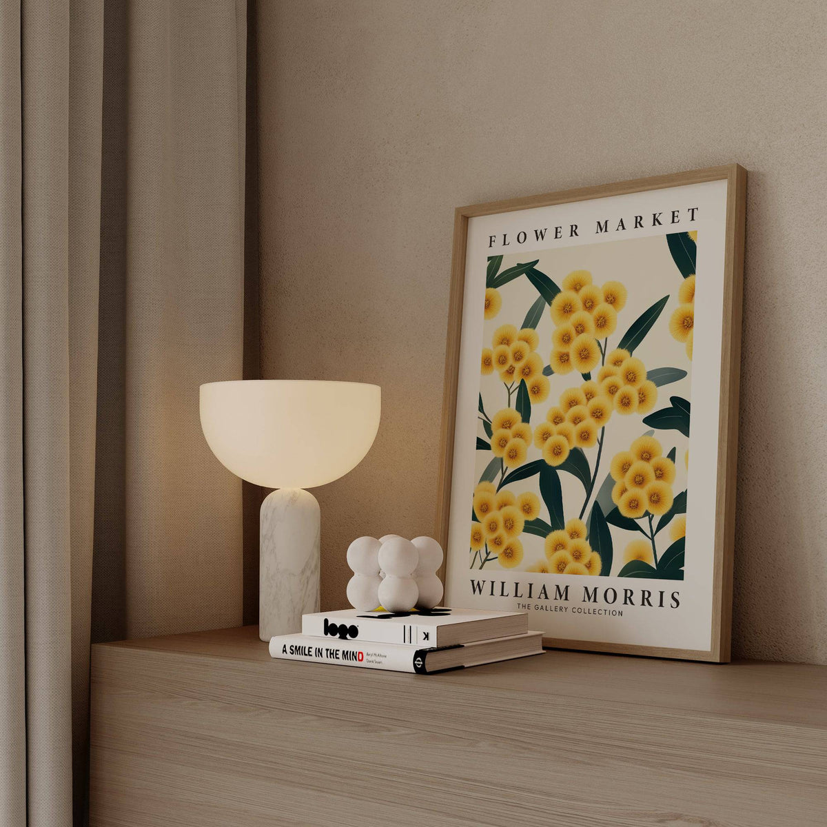 Yellow Flower wall art leaning on a shelf surrounded by a white lamp and stacked books