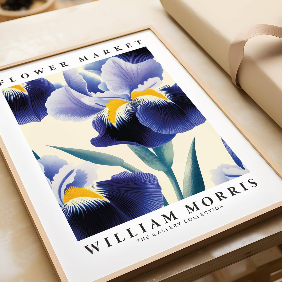 Close-up of purple flower wall art showing blue irises with yellow and green details on a cream background
