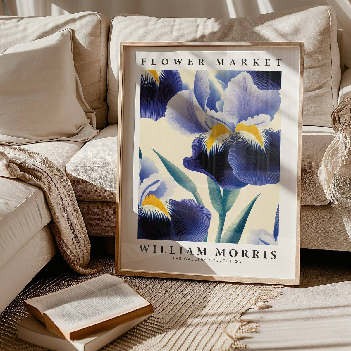 Print leaning on a rug by a beige sofa showing blue iris flower with green leaves in vintage style