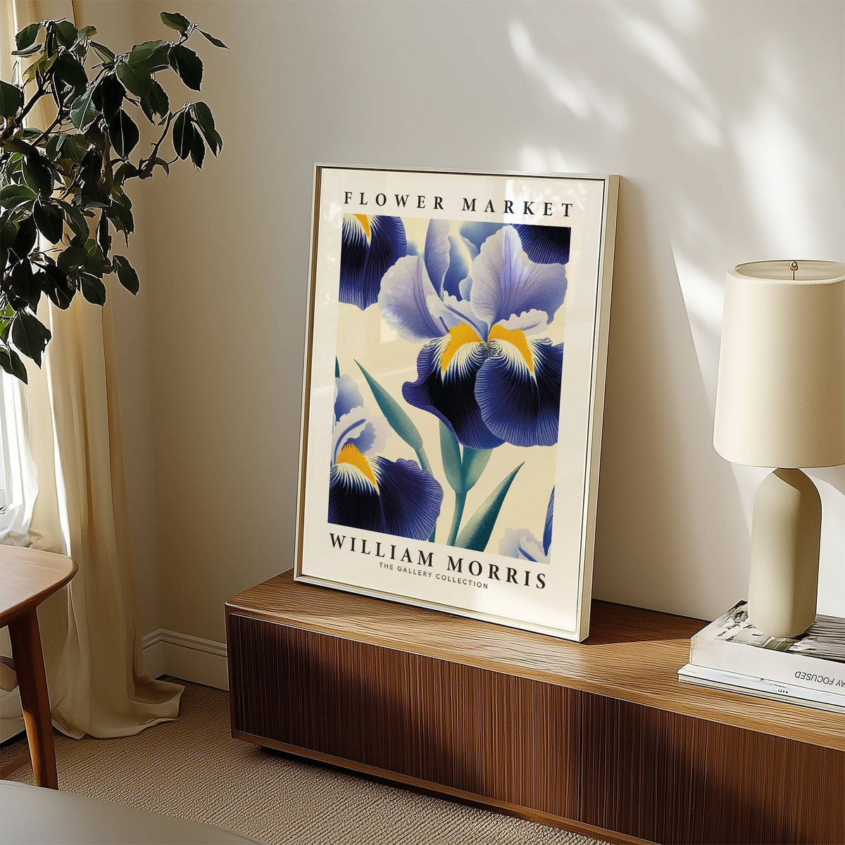 Print leaning on a wooden shelf of purple flower wall art with yellow and green details near a lamp and houseplant