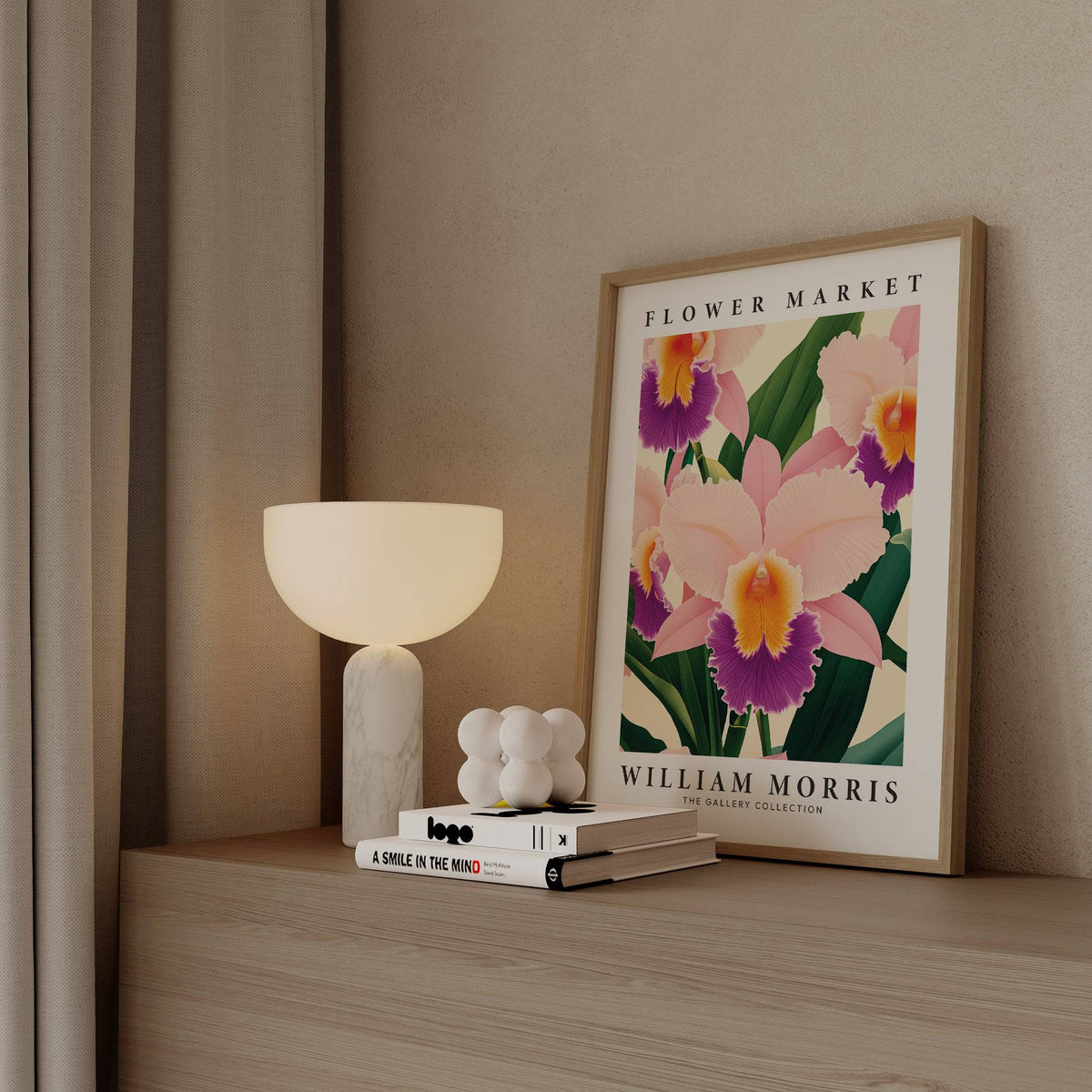 Print leaning on shelf of pink orchid illustration with purple highlights beside a white lamp