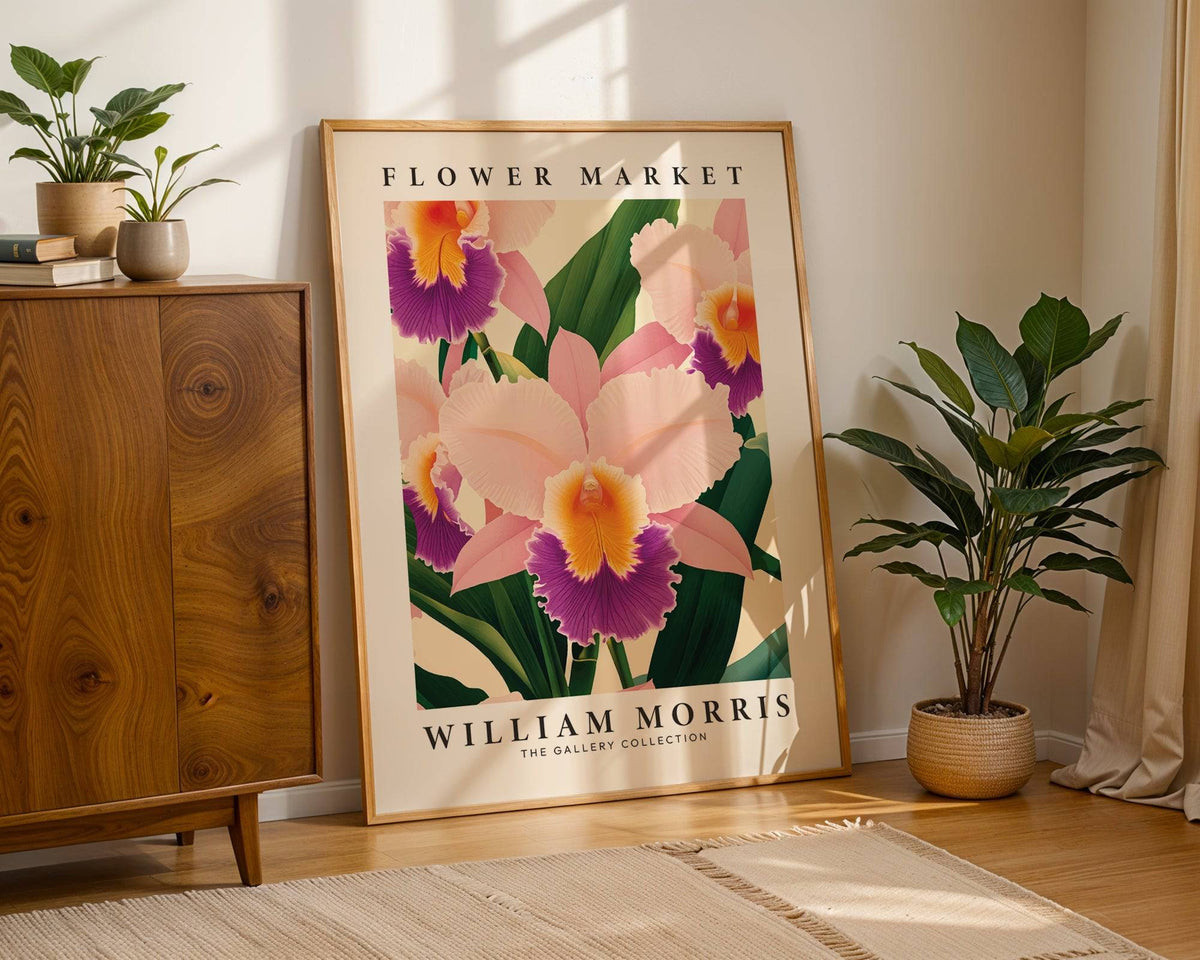 Wall Art Orchids print leaning on the floor with pink orchid flowers and green leaves in a sunlit corner