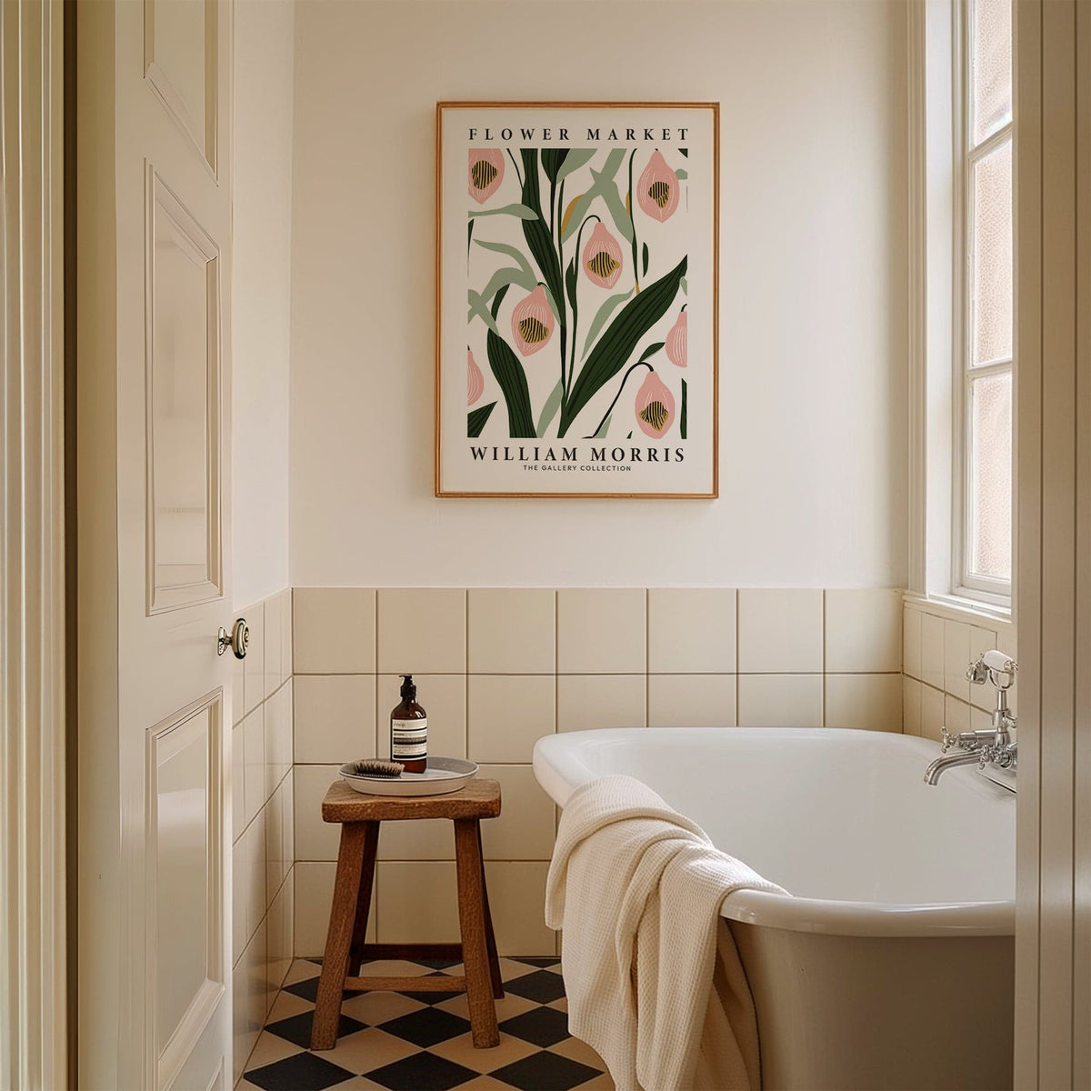 Paintings of Orchids above a bathtub in a beige tiled bathroom with a wooden stool
