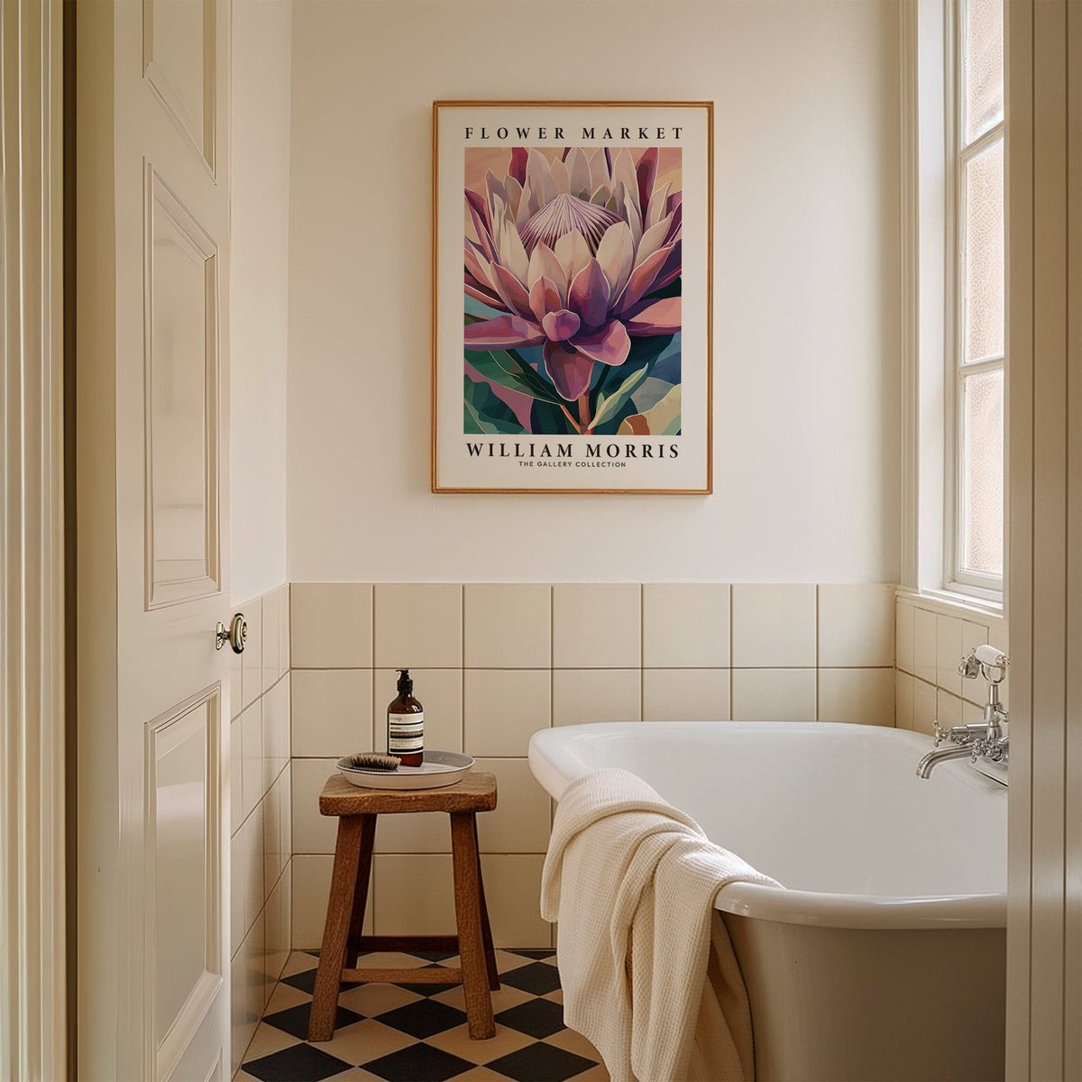 Flower wall art of a king protea flower in muted pinks and greens above a wooden stool in a bathroom