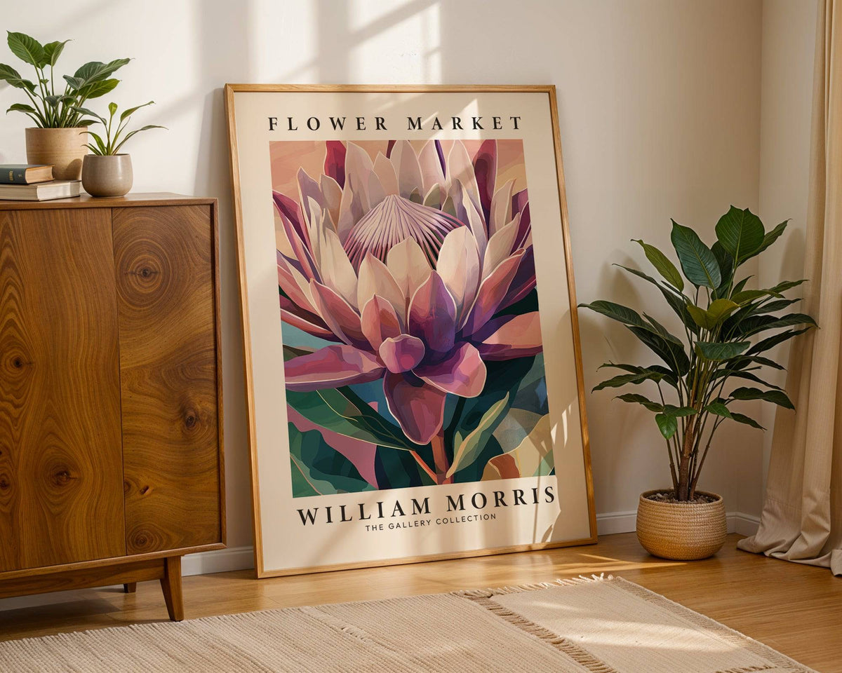 Flower wall art illustration of king protea flower with pink and purple hues leaning against a wall beside a plant