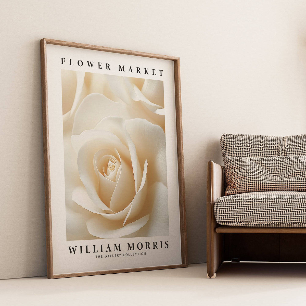 Floral wall art for living room leaning against a cream wall next to a checkered sofa