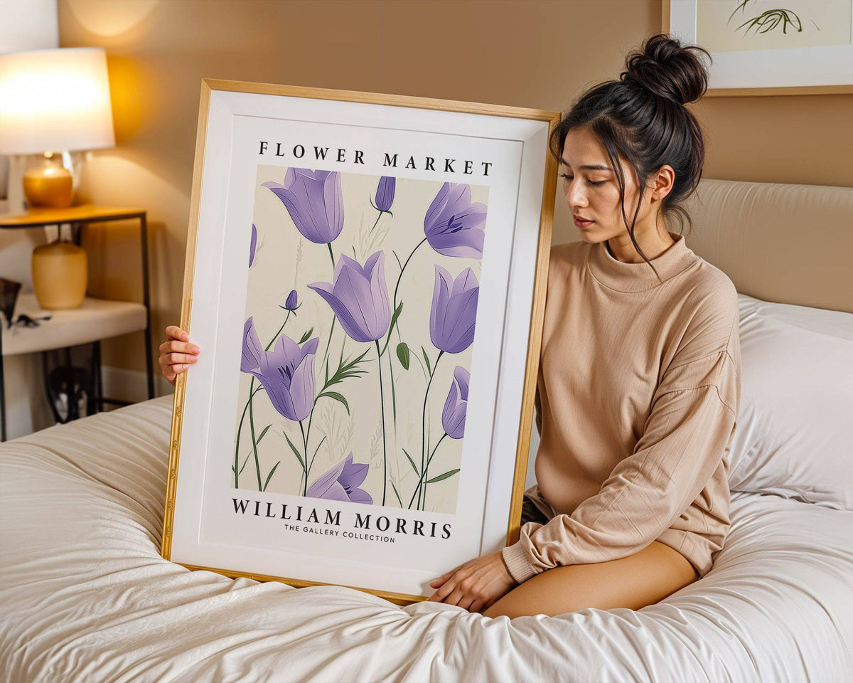 Wall Art Tulips framed print with purple bell flowers held by a woman on a bed