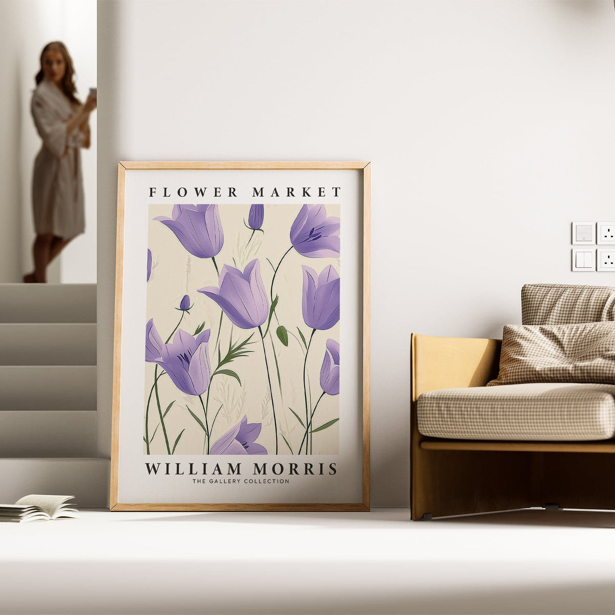 Wall Art Tulips print with purple bell flowers leaning against the wall beside a checked cushion on a sofa