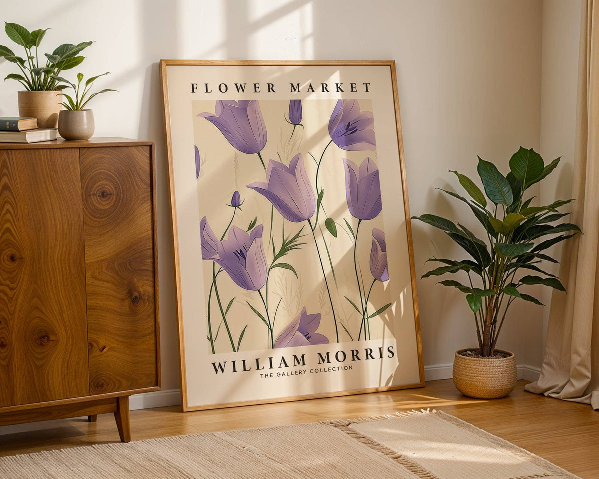 Print leaning on floor of Wall Art Tulips with purple bell flowers and beige background near a green plant