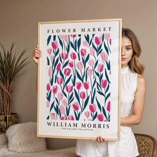 Framed print of Tulip Decor with pink tulips and dark stems held by a person