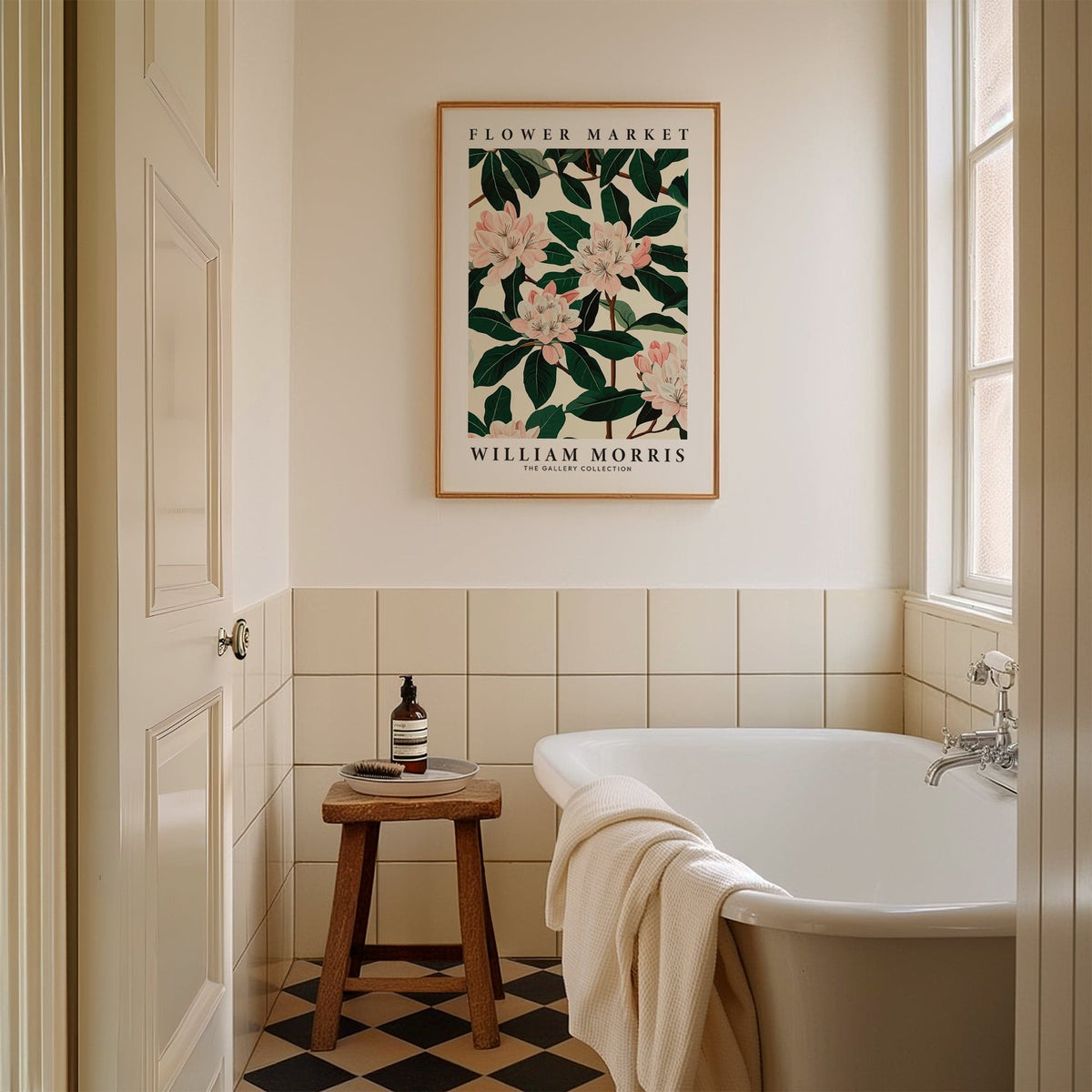 Magnolia wall art framed print with pink flowers and green leaves above a stool in a bathroom