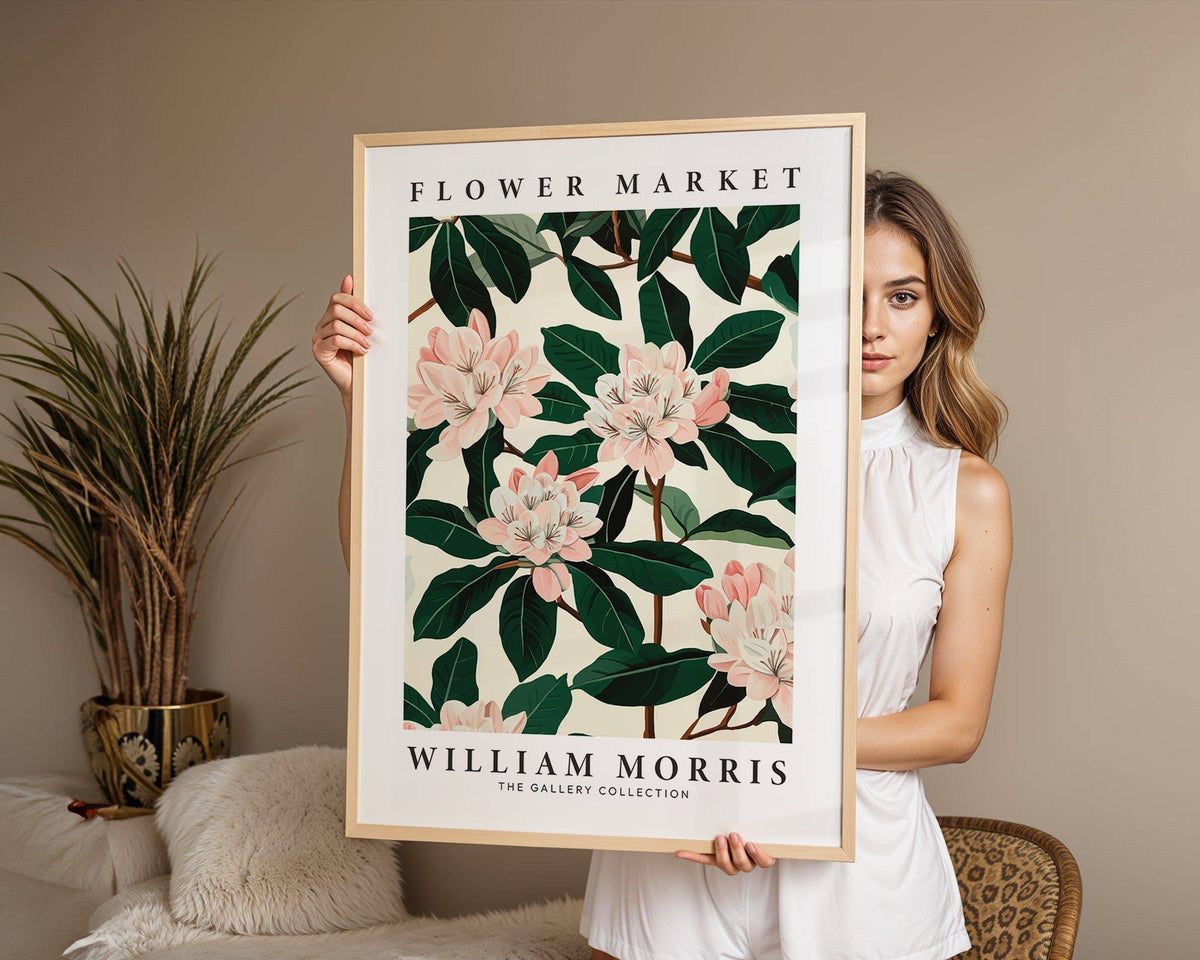 Magnolia wall art framed with botanical magnolia flowers in green and pink held by a woman