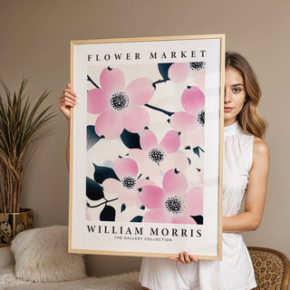 Prints for Bathroom framed print of pink dogwood flowers with text held by a woman