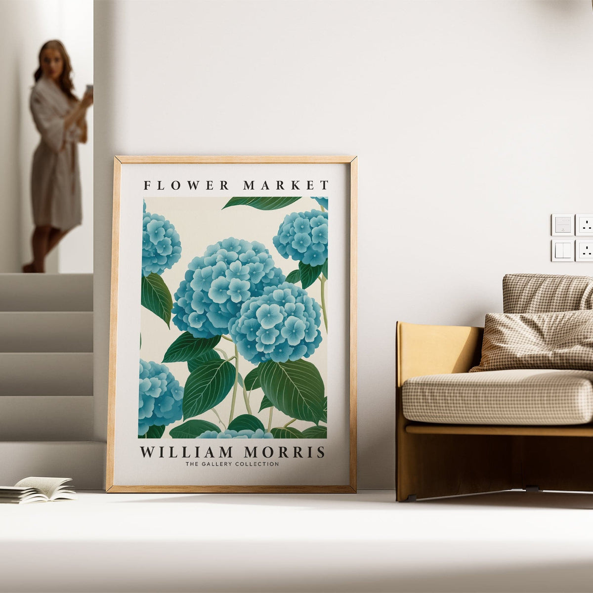 Flower Market Prints leaning print of blue hydrangea flowers with green leaves beside a brown chair