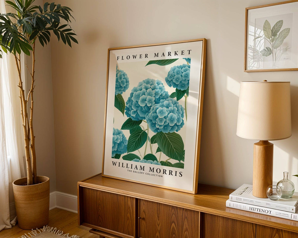 Flower Market Prints print leaning on a wooden sideboard with a lamp and plant in a light room