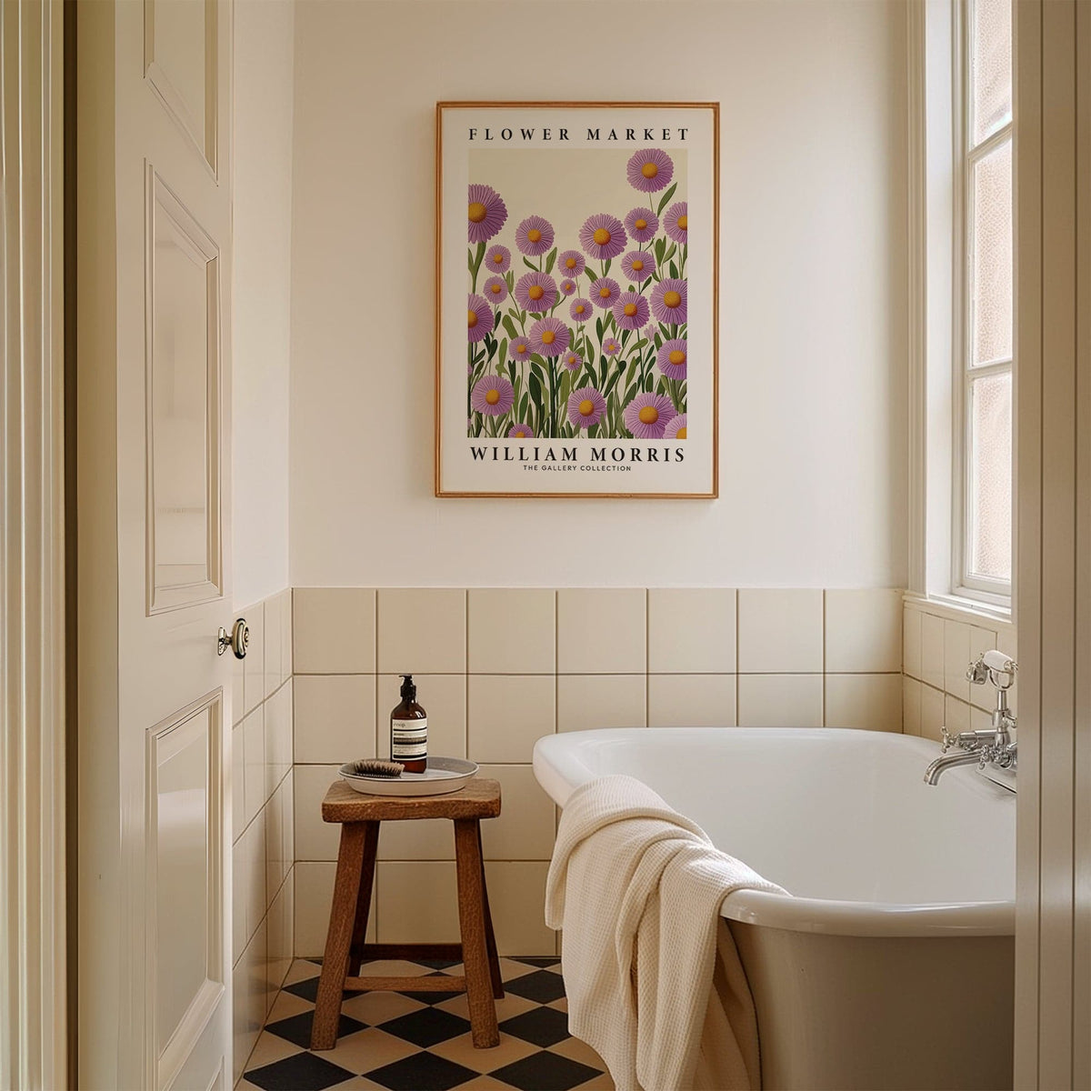 Purple floral wall art of purple daisies in greenery above a wooden stool next to a bathtub