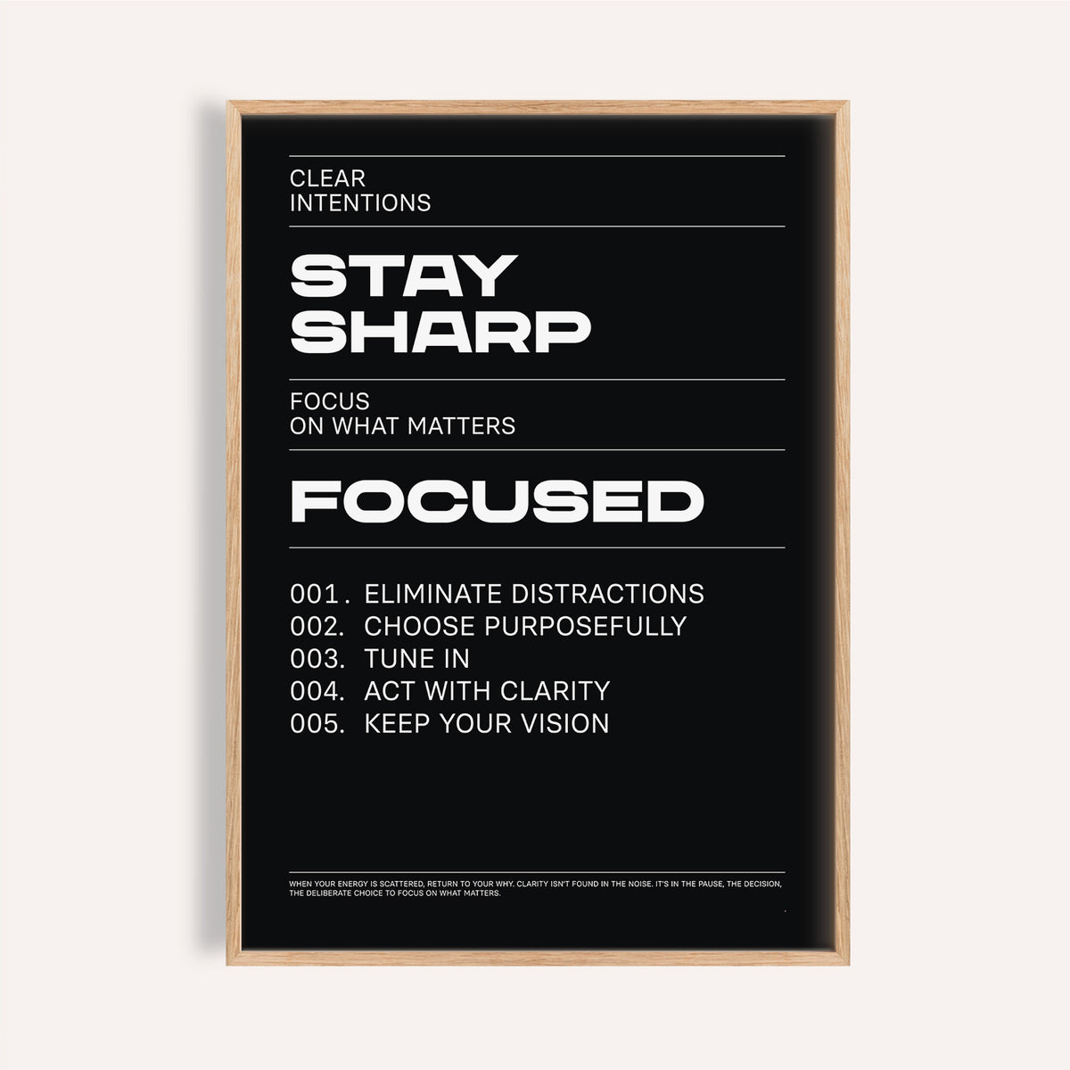 Stay Focused Poster with bold white text Stay Sharp on a black background in a wooden frame
