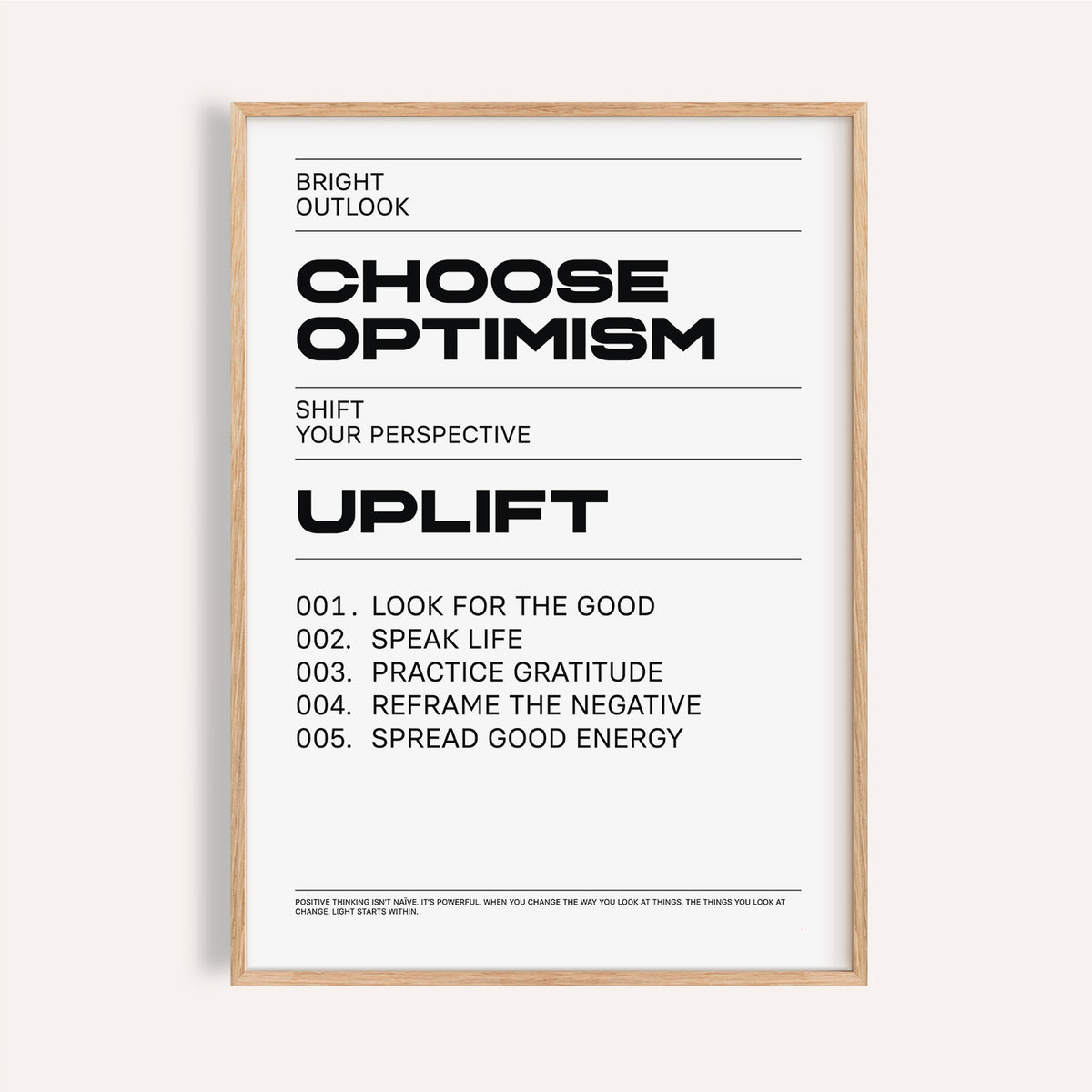 Framed uplifting wall art with black typographic motivational text on a white background