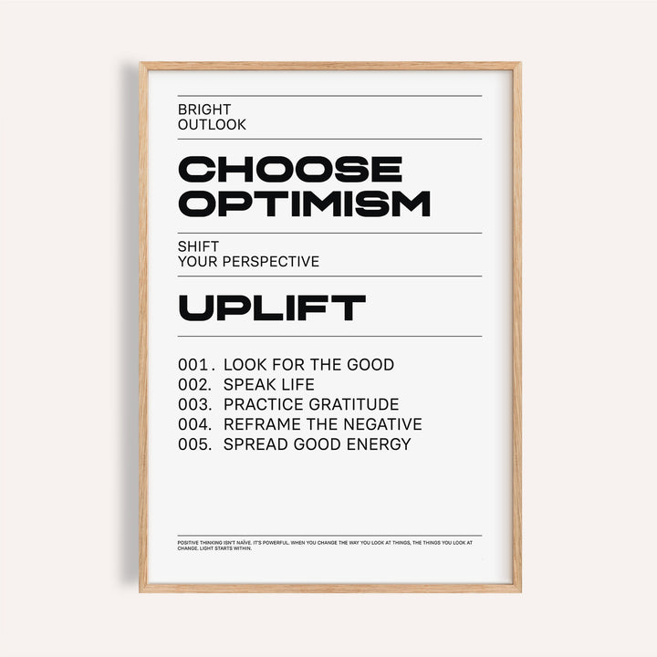 Framed uplifting wall art with black typographic motivational text on a white background