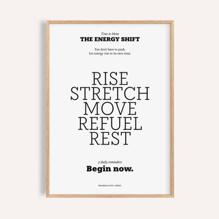 Framed print with an inspirational saying in black typography on a white background