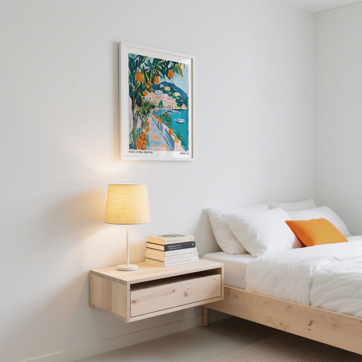 Art Prints of Italy wall art showing an orange tree by the seaside with bright blues and greens above a bedside table with a lamp