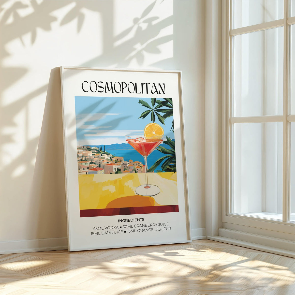 Print leaning on a wooden floor with cosmopolitan cocktail illustration in warm colours by a window